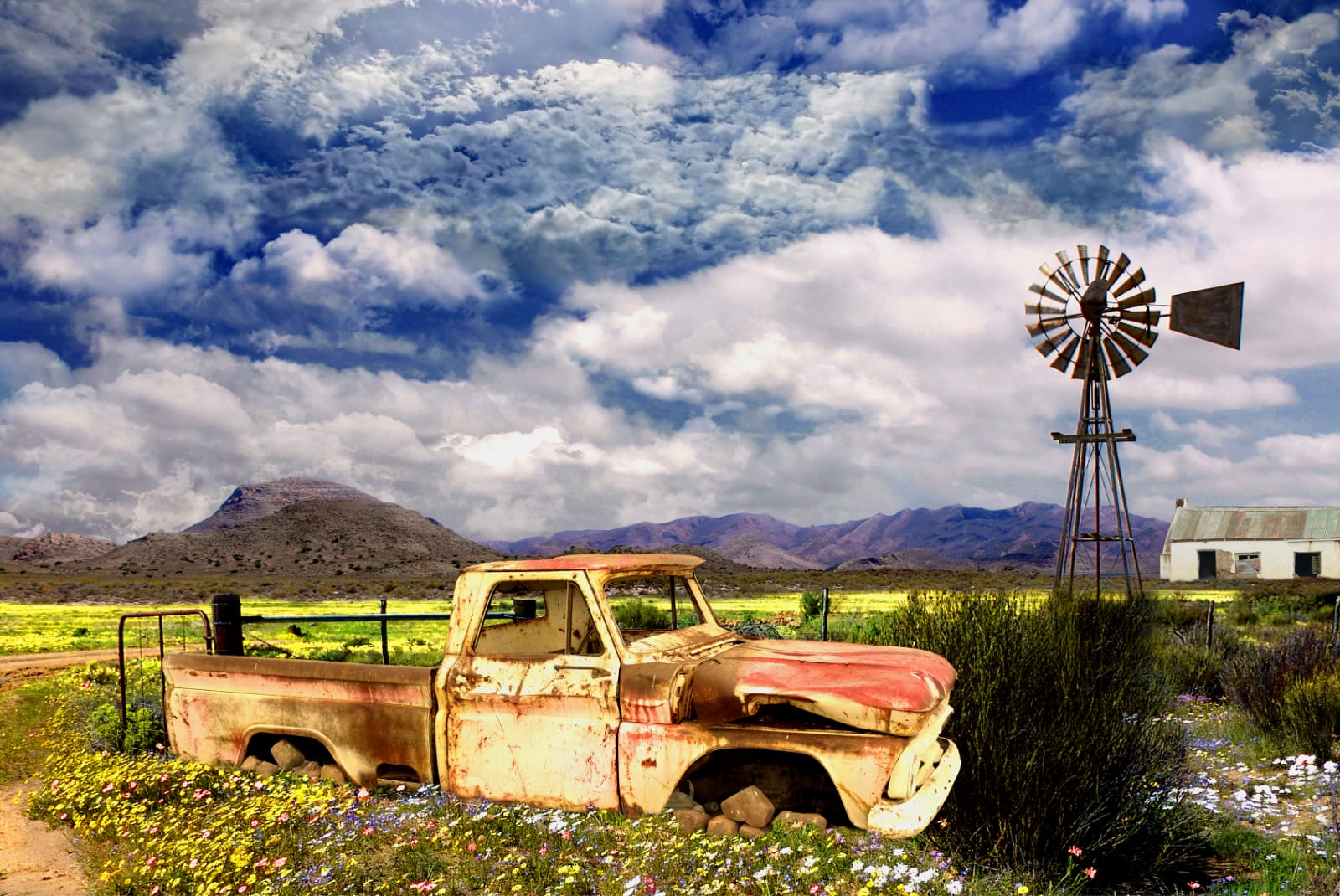 A3-Rusted Truck with a Windmill view Canvas