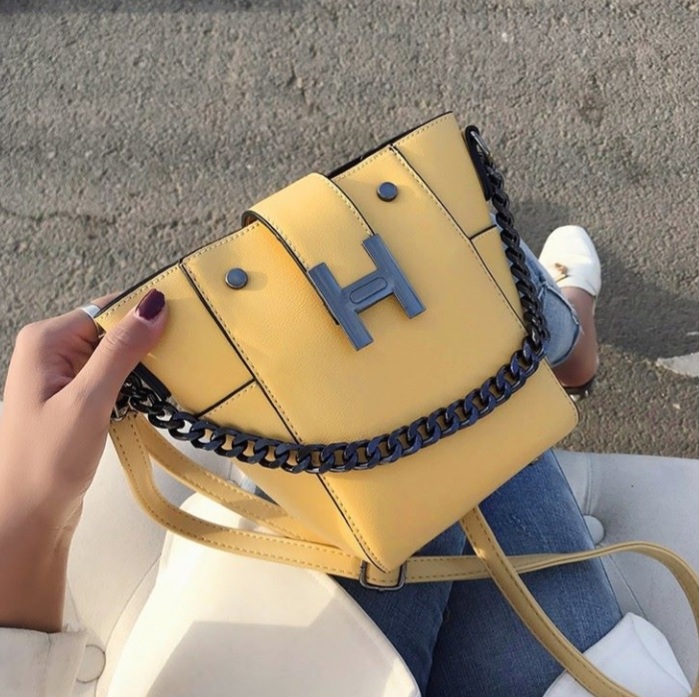 Ladies hand bag with chain and belt